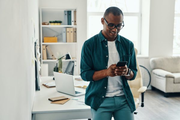 Happy employee using Ronspot mobile app