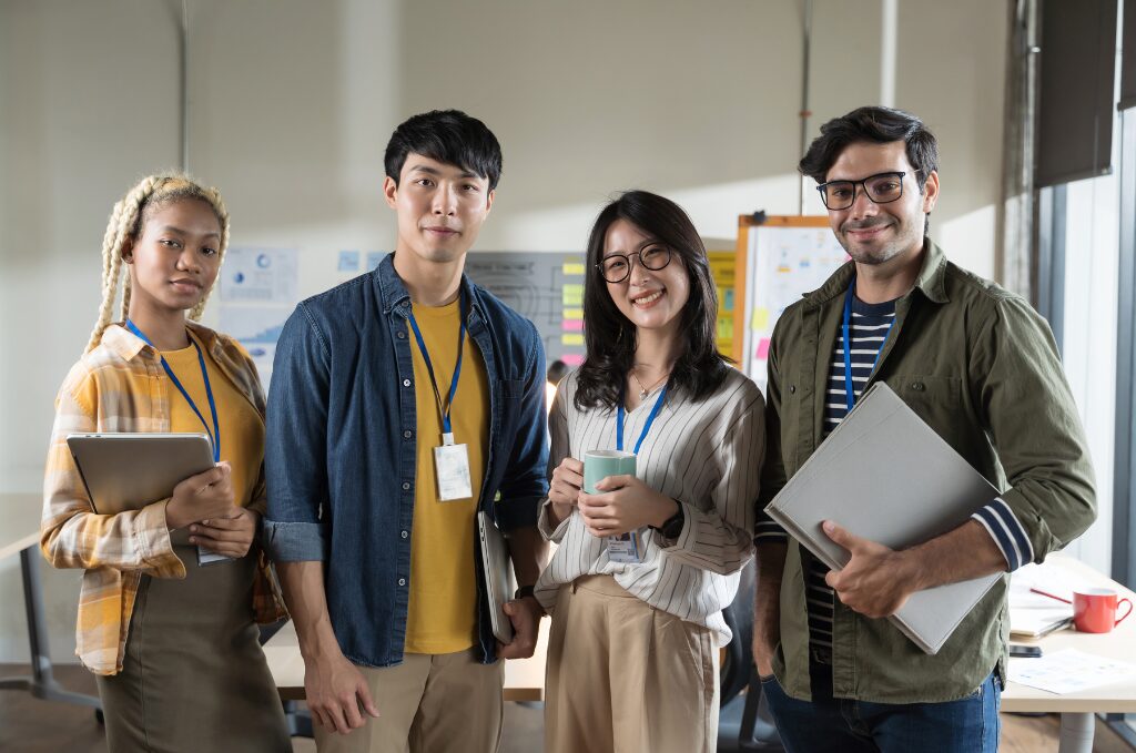 a group of diverse, happy young employees